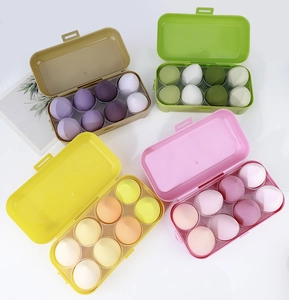 Detailed set of 8 teardrop makeup sponges in gradient colors within a plastic storage box