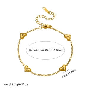 Gold plated stainless steel heart charm bracelet with starburst crystals and extender chain