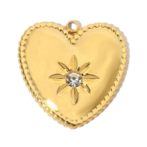 Macro detail of gold-plated hollow heart pendant with sparkling starburst cubic zirconia