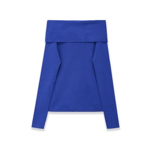 Detail of navy blue off-shoulder knit top featuring vertical ribbed texture and elastic hem
