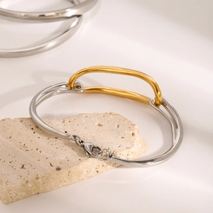 Minimalist 18k two-tone gold and silver stainless steel bracelet with lobster clasp