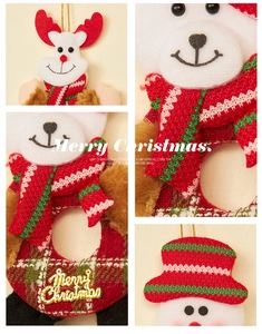 Macro detail of plush Christmas ornaments with gold Merry Christmas lettering and reindeer