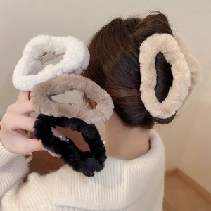 Cross plush claw clip set in various colors shown on model for autumn winter hair styling