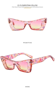 Vista frontale e laterale di occhiali da sole cat eye con montura floreale rosa e sfumata