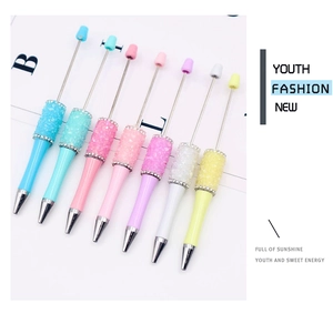 Colorful DIY crystal rhinestone beaded pen set in vibrant pink, blue and purple