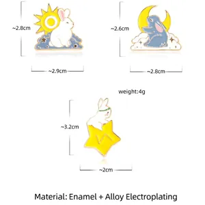 Three-piece cartoon rabbit enamel pin set featuring sun, moon and star metal designs