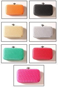 Detailed close-up showing woven texture and various colors of evening clutch bags