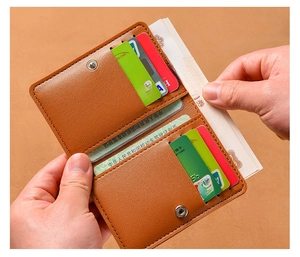 Brown leather wallet showing card slots and large cash compartment in detail