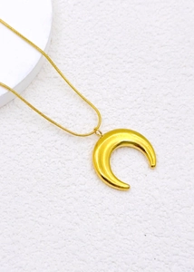 Close-up of a golden crescent moon pendant on a refined snake chain for men and women