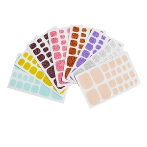 Eight-piece set of glitter toe nail stickers in assorted vibrant solid colors