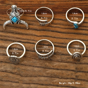 6-piece vintage turquoise rings set with silver-tone western bohemian style on wood