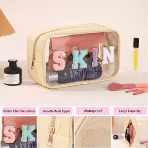 Detail of glitter chenille letters SKIN on a clear waterproof PVC makeup travel bag