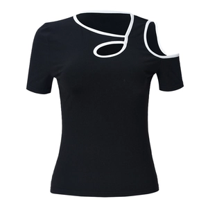 Detail of asymmetric hollow-out shoulder and white contrast piping on black slim top