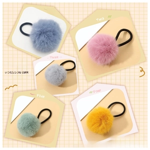 Detailed set of five colorful faux fur pom pom hair ties with elastic bands
