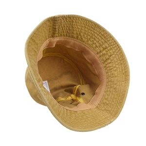 Vintage washed khaki bucket hat showing internal cotton structure and stitching details