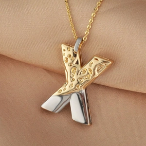 Two-tone alphabet X pendant necklace with hammered gold and polished silver finish