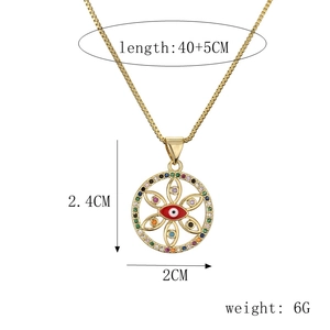 Detail view of gold evil eye pendant with size dimensions and weight specifications