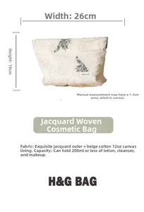 Detail view of jacquard makeup bag showing dimensions 26cm x 18cm and canvas interior