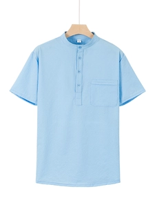 Detail of light blue waffle texture polo shirt with mandarin collar and chest pocket