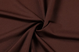 Macro shot of dark brown knitted fabric detail showing texture and glossy finish