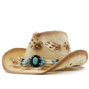 Detail of woven straw cowboy hat featuring turquoise stone and ethnic beaded band