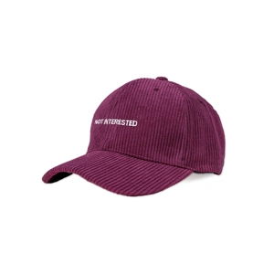 Detailed view of purple corduroy fabric texture and NOT INTERESTED embroidery on baseball cap