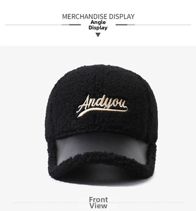 Detailed view of the 'Andyou' embroidery on a fuzzy black fleece baseball cap