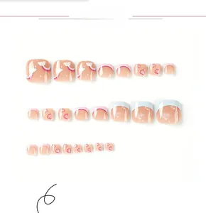 Detail view of 24pcs blue and pink French press-on toenails with rainbow cloud patterns