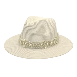 Detailed close-up of woven straw fedora hat featuring elegant white pearl bead trim