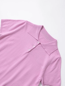 Detail of lavender knit polo shirt showing ribbed collar and three white buttons
