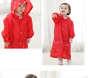 Detail view of red waterproof kids raincoat with hood and white snap buttons