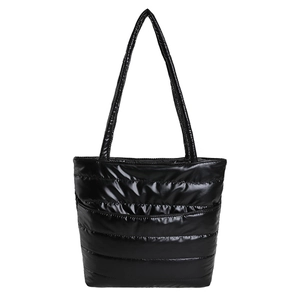 Glossy black quilted puffer tote bag with long shoulder straps for winter fashion style
