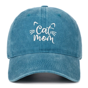 Detailed front view of washed denim baseball cap featuring white Cat Mom embroidery