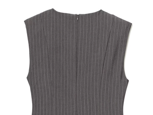 Detail of invisible back zipper and grey striped knit texture on a sleeveless dress