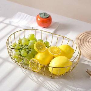 Nordic gold iron wire fruit basket with oval hollow design and decorative fruits