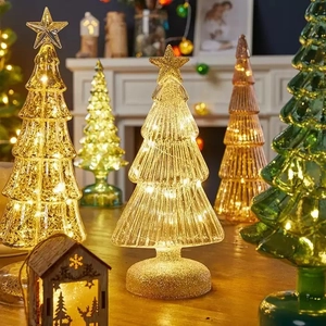 Illuminated glass Christmas tree with LED lights and star topper for home holiday decor