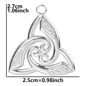 Macro detail of silver Celtic knot charm with spiral relief and size measurements