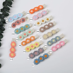 Cute handmade crochet flower hair clips in 16 colors for girls on a clean white background