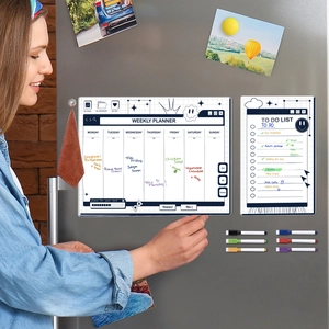 Action shot of a weekly planner and to-do list magnet set with six markers on a fridge