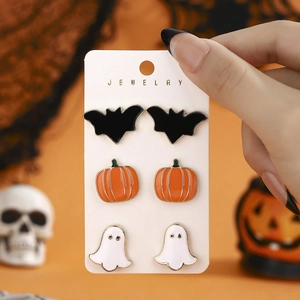 Halloween earring set featuring black bat, orange pumpkin, and white ghost stud designs