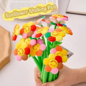 Dettaglio di una penna gel a forma di girasole colorato con sorriso e fusto verde