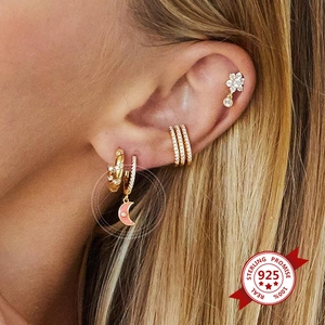 Detailed view of s925 silver gold-plated moon earring with pink enamel and zircons