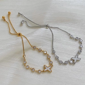 Elegant adjustable zircon pull bracelet set in gold and silver finish with shell inlay