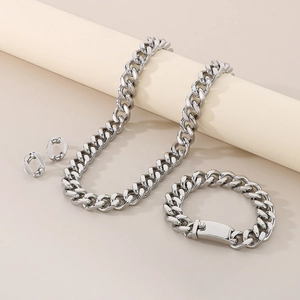 Polished silver cuban link jewelry set featuring matching necklace, bracelet and earrings