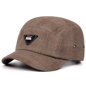 Detail of 5-panel brown baseball cap showing durable grid texture and BODA leather patch