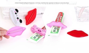 Close-up of cute cartoon animal toothpaste squeezer showing lip and panda designs