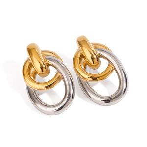 Minimalist two-tone interlocking earrings in gold and silver stainless steel hoops
