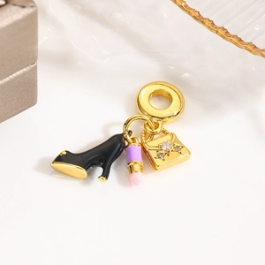 Detailed charm set featuring a black high heel, lipstick, and handbag for a charm bracelet