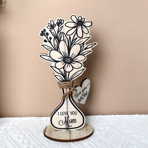 Close-up of wooden flower ornament for Mother's Day with Love you MOM engraving