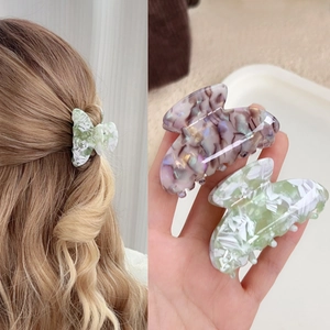 Elegant acetate butterfly hair claw clips in tortoise shell and marble green for women